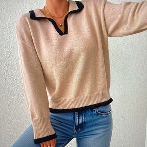 Elegant Cream Sweater with Black Trim
